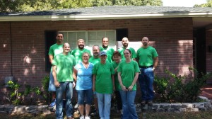 Volunteers with TECO's South Hillsborough Operations team put down the paint brushes to pause for a photo. 