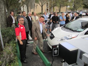 Mayor Frank Chillura gets ready to plug into a Nissan LEAF.
