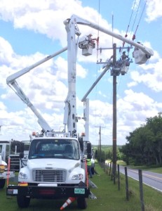 Tampa Electric crews install a recloser near Dade City.