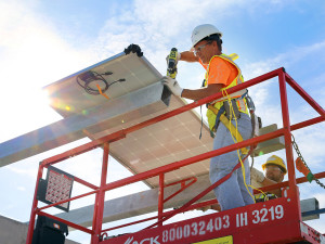 The first solar panel goes into place atop the south economy parking garage at Tampa International Airport.