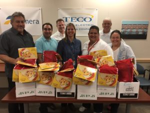 TECO team members - like those here with the Distributed Systems team within Network Engineering & Operations - are ready to fill their holiday stockings. 