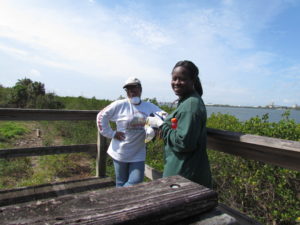 Cheryl Johnson, left, and Patrice Jackson at the McKay Bay observation tower - now with a better view of the surrounding habitat that it's had in a long time thanks to the invasive-species removal efforts of volunteers from TECO and elsewhere.